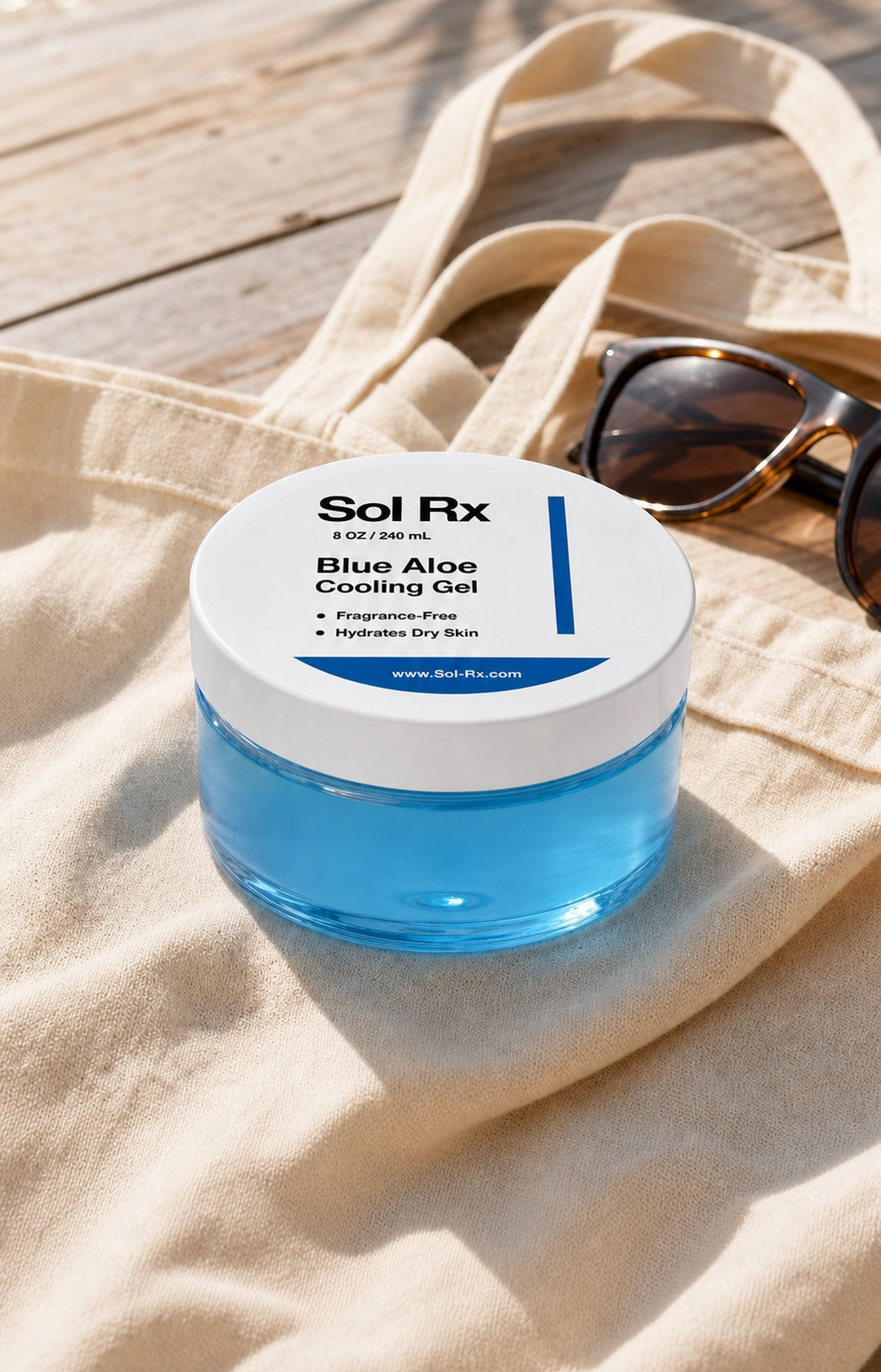 Sol Rx Blue Aloe Cooling Gel with beach bag and sunglasses